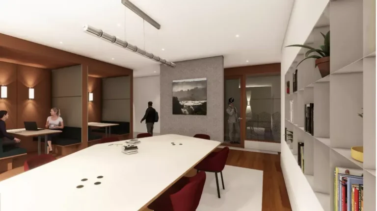 spacio de trabajo colaborativo con estanterías de libros y cabinas de reunión en el coworking Spaces La Illa Diagonal.